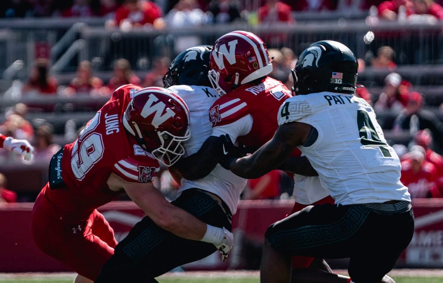 Wisconsin defenders tackle a Michigan State ball carrier during the Badgers’ 31-3 win at Camp Randall Stadium. Wisconsin defenders tackle a Michigan State ball carrier during the Badgers’ 31-3 win at Camp Randall Stadium.