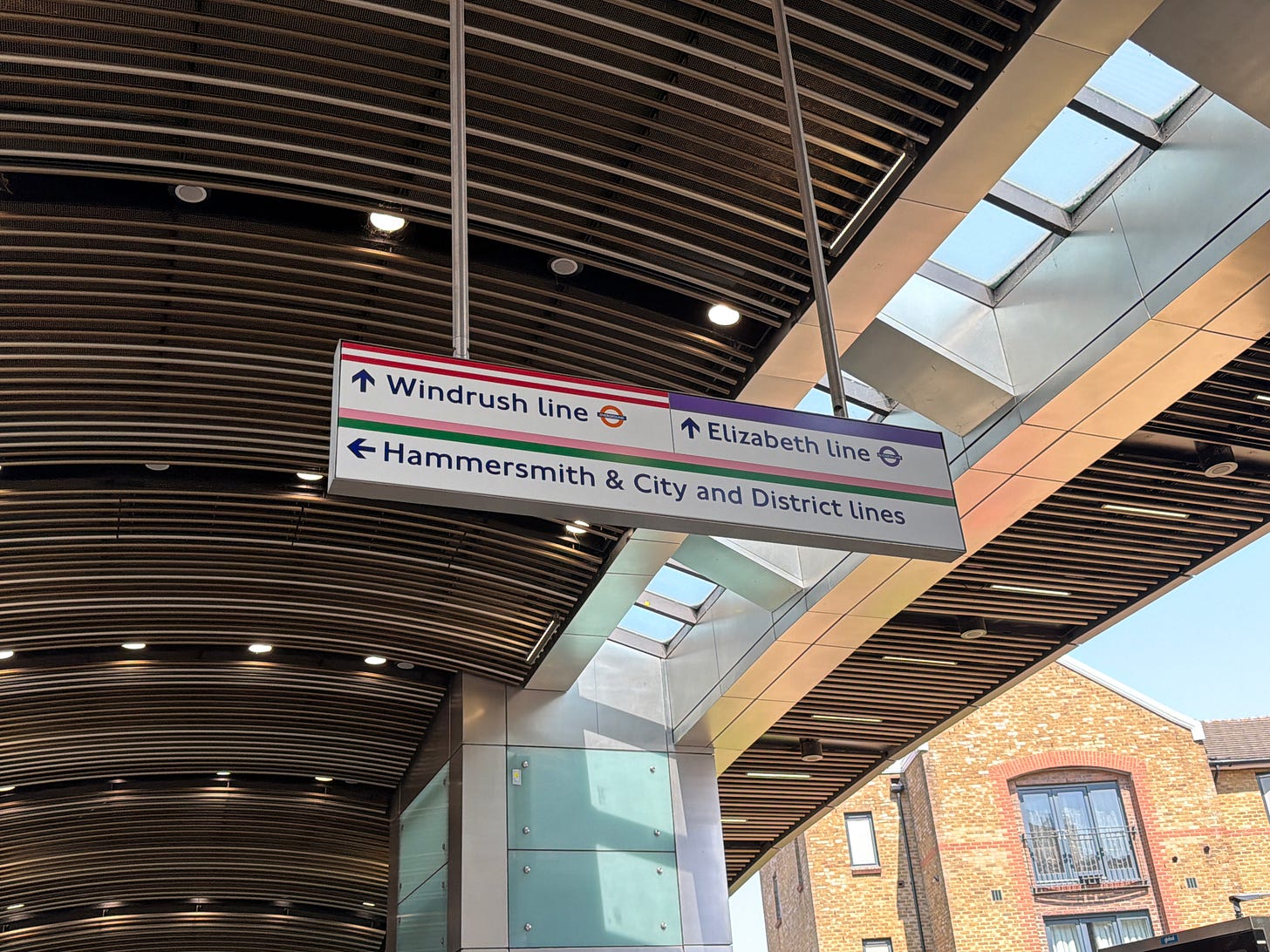 Photo of a wayfinding sign showing Windrush, Hammersmith & City, District and Elizabeth lines.
