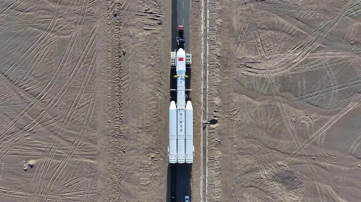 The Kinetica-2 Y1 vehicle being taken to Launch Area 140 (left) and its nine YF-102 engine seen before being moved into a launch position (right).