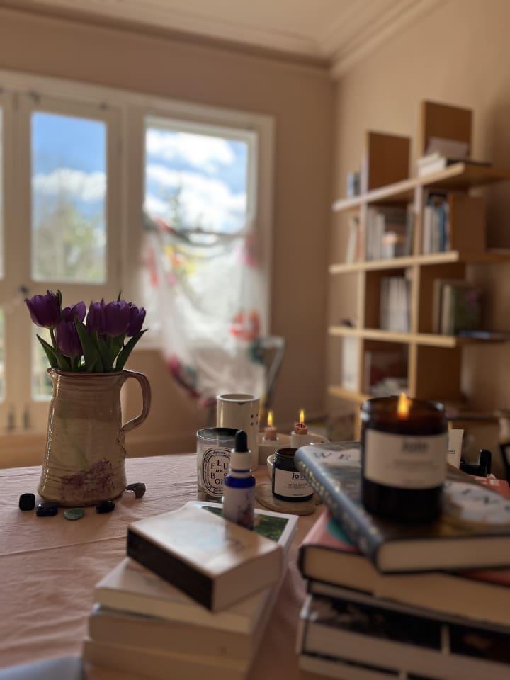 Curtain in the wind, tulips and candles