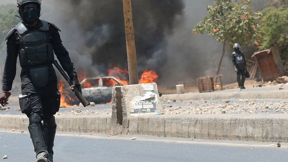 Police officers block the entrance to the Cheikh Anta Diop University, in Dakar 3, during unrest following the sentencing of Ousmane Sonko - 1 June 2023