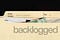 backlogged