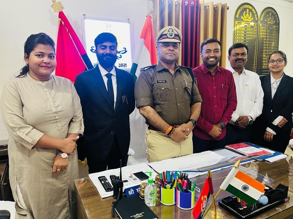 A group of five people, consisting of the team of LAW Foundation, taking a photo with an Ara Mandal Kara Central Jail Official