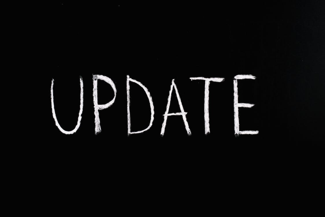 Free Update Lettering Text on Black Background Stock Photo