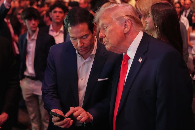 President Donald Trump speaks with Secretary of State Marco Rubio during UFC 327 at Kaseya Center on April 11, 2026 in Miami, Florida.