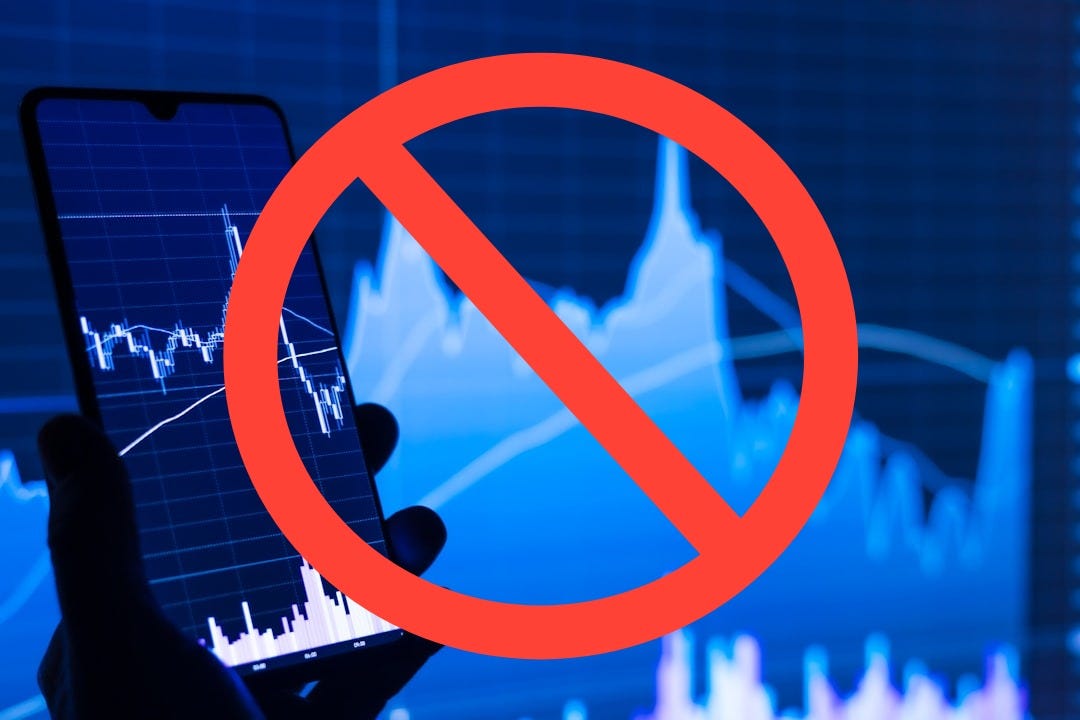 a person holding a cell phone in front of a stock chart a person holding a cell phone in front of a stock chart