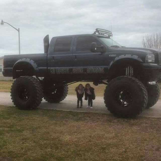 Huge monster Ford truck with stacks and big mud tires