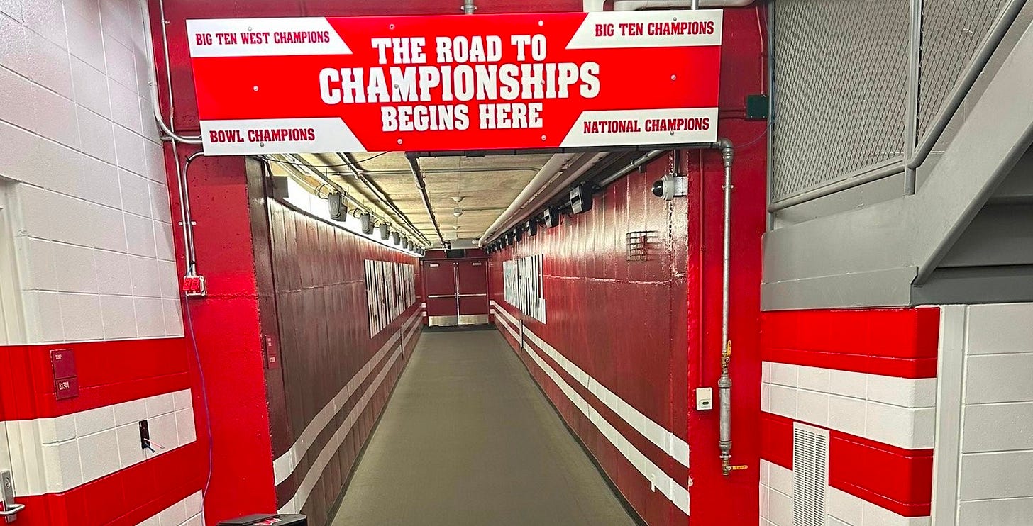 Photo of the Camp Randall Stadium tunnels displaying the message “The Road to Championships Begins Here.”