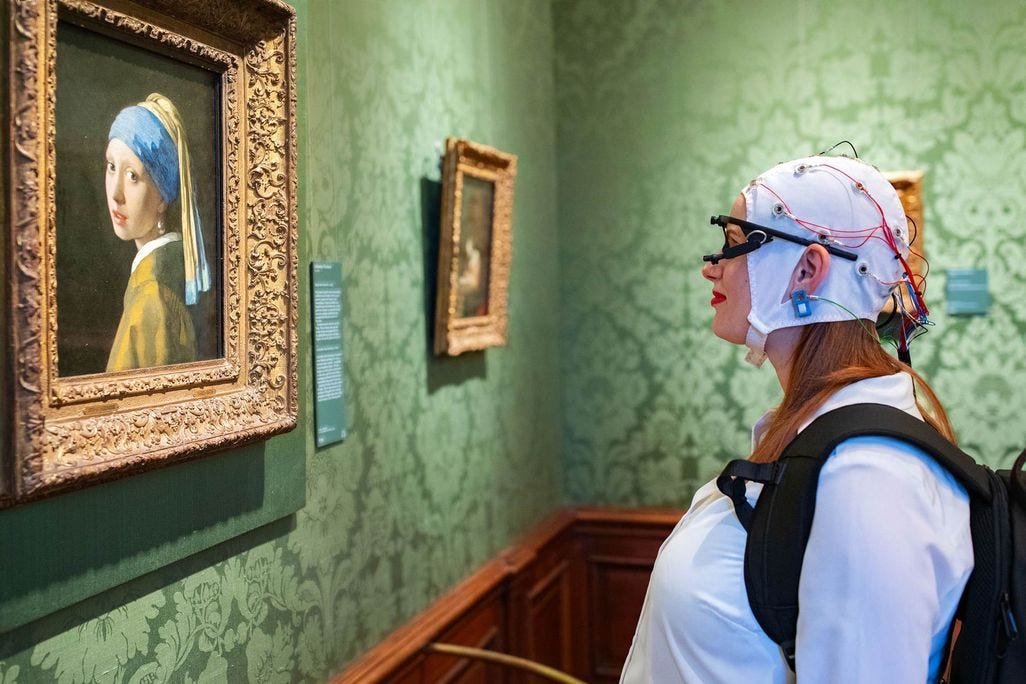Woman looks at painting