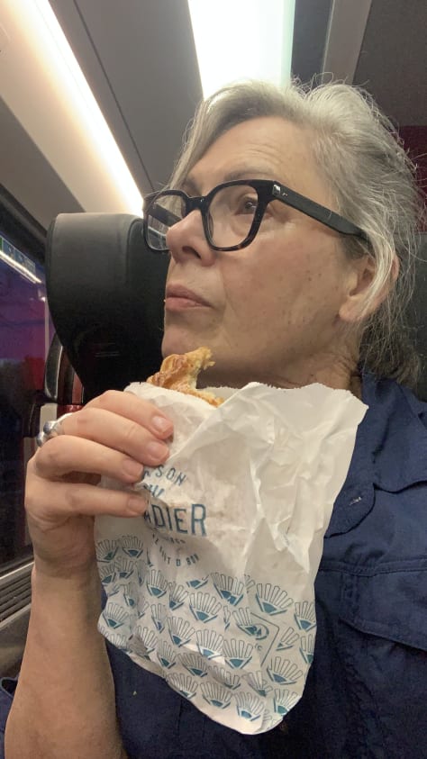 woman out hiking eating food whilst walking