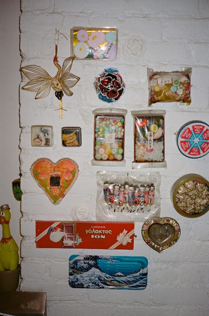 Close-up of a cake stand filled with vintage wind-up toys on a table