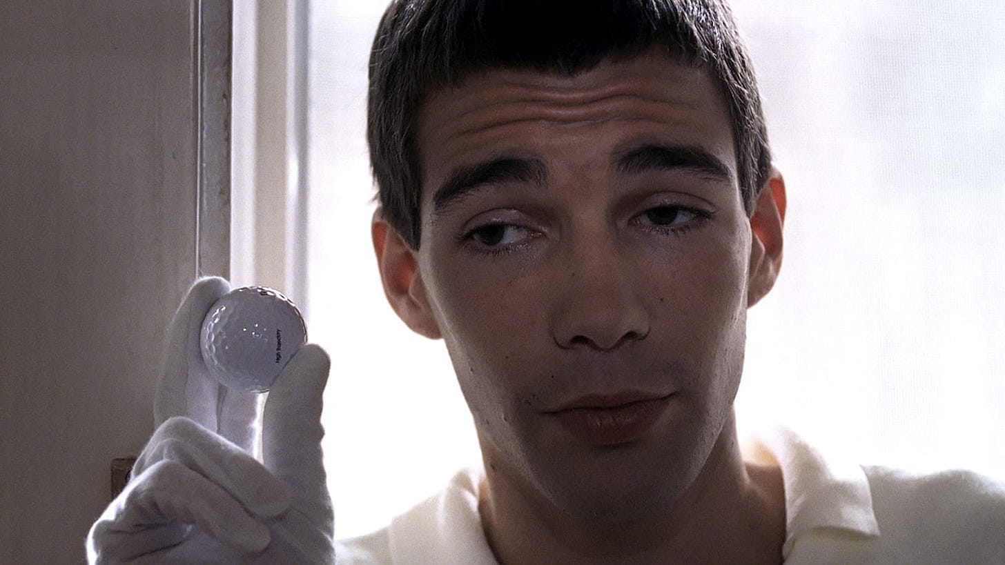 Funny Games | Still features Arno Frisch as Paul holding a golf ball between two fingers.