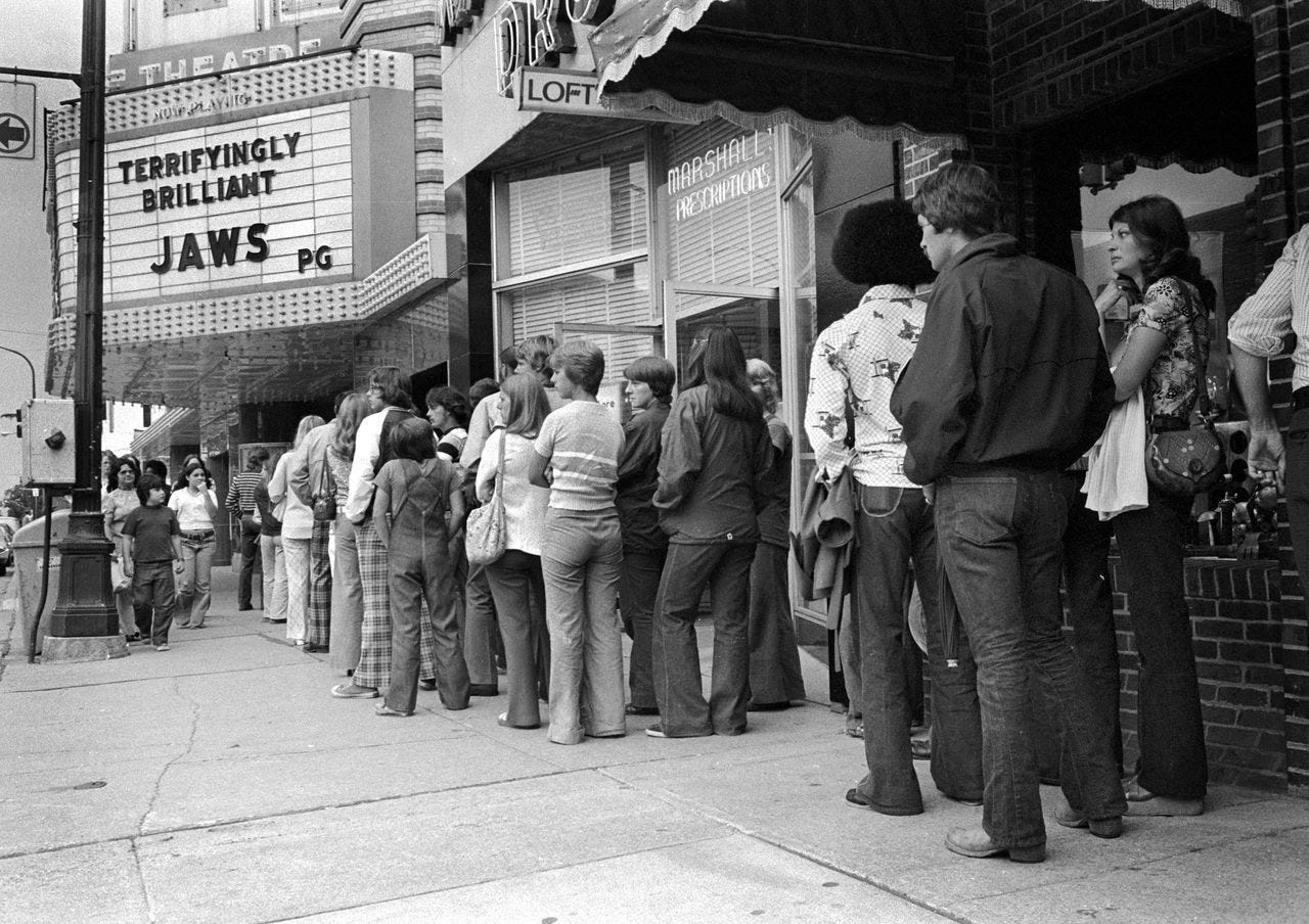 Moviegoers in Ann Arbor, Michigan, line up on July 14, 1975, outside the State Theatre when it was showing “Jaws.” (Steve Kagan/Getty Images)