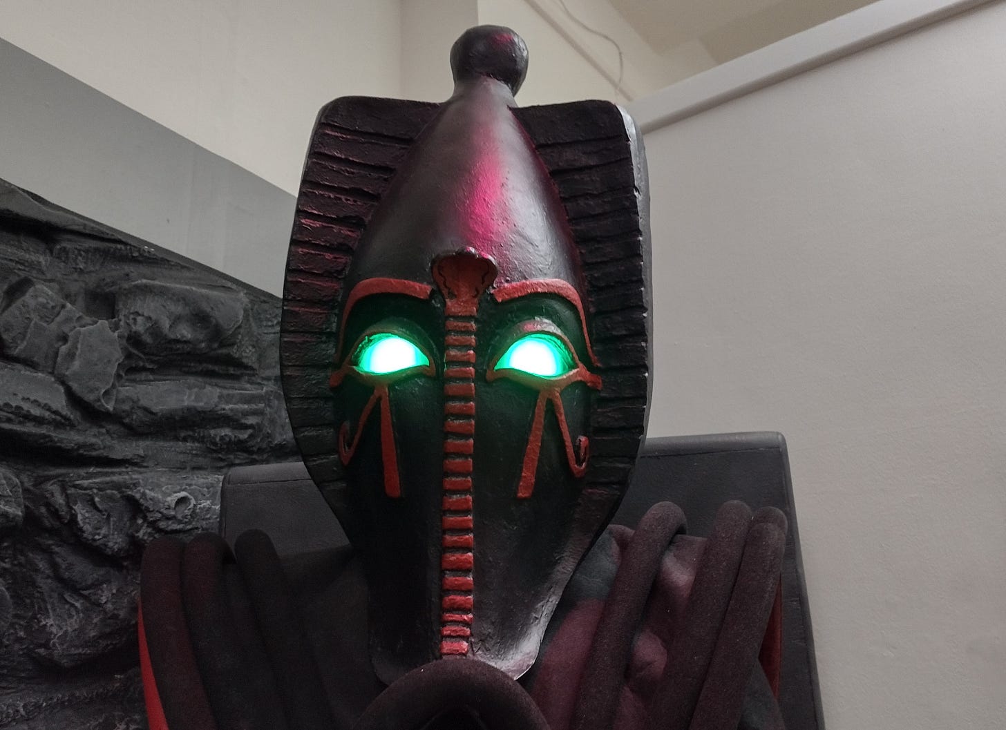 Profile shot of Sutekh from Pyramids of Mars, his eyes illuminated.