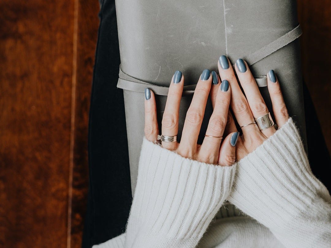 A woman covering her face with her hands