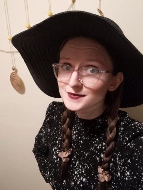 Goth Barbie look; witch-adjacent hat + red lip + celestial dress look; Bat-inspired look that ended up sort of Maleficent-y