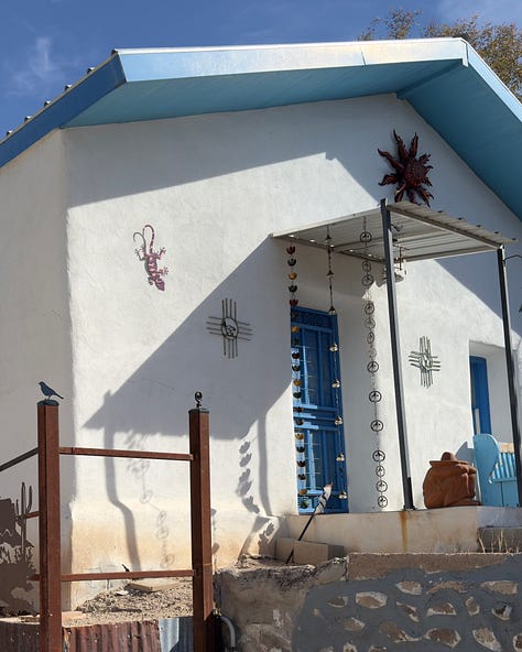 The photos display nine homes in the Sonoran architectural style traditional to the Southwest of the United States. The homes feature flat roofs, front walls that begin at the sidewalk's edge, colorful stucco exterior walls, and large windows.