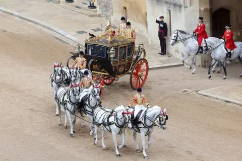 Chris Jackson/Getty Images King Charles III and U.S. President Donald Trump in the Irish State Coach during the State visit by the President of the United States of America at Windsor Castle on September 17, 2025 in Windsor, England. 