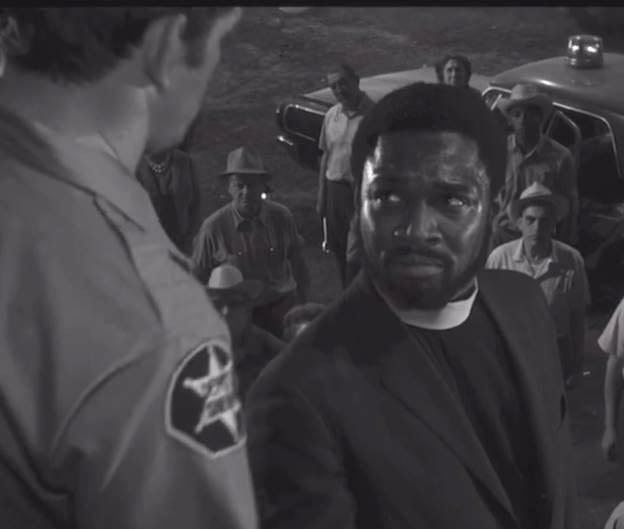 A person in a suit talking to a police officer

AI-generated content may be incorrect.