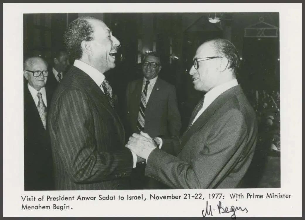 The Begin–Sadat handshake, signed by Begin.