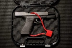 gun locked safely in a container