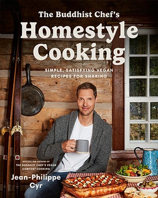 Image of cover of the Buddhist Chef's Homestyle Cooking Book. The cover photo is of the chef sitting on a porch surrounded by food. 