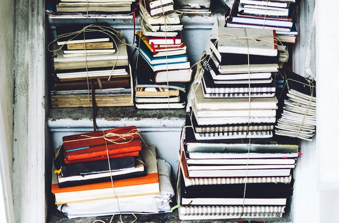 closeup photo of assorted-color book lot