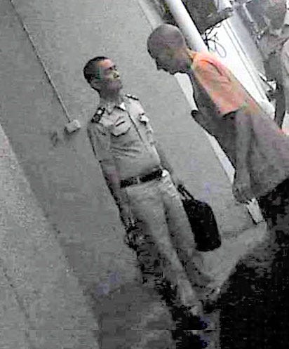 Roger Clark is on his way into court in Thailand. He was subsequently extradited to the US.