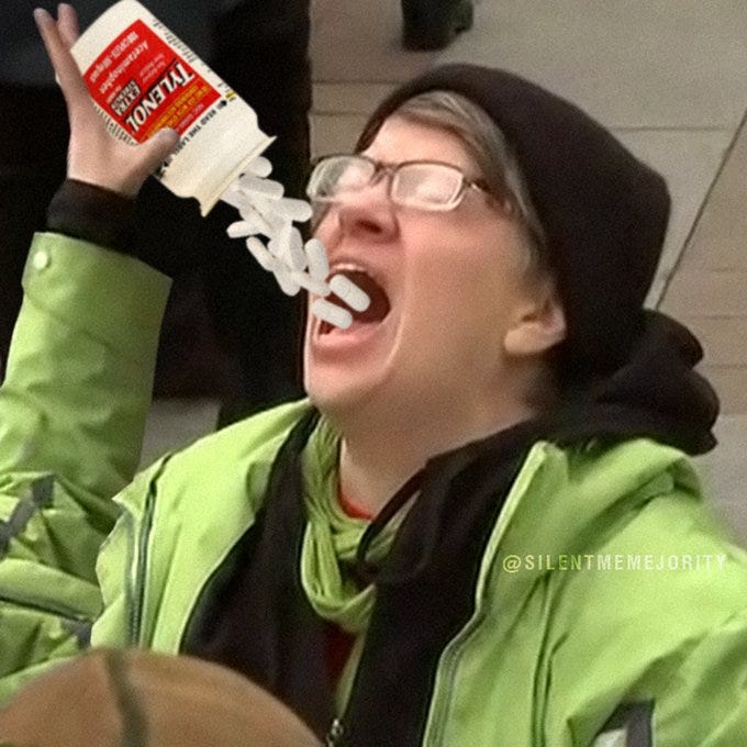 A person wearing a green jacket and black beanie pours white Tylenol pills from a bottle into their open mouth. The person has glasses and a scarf, standing outdoors. A watermark "@SILENTMEMEMAJORITY" is visible in the bottom right corner.