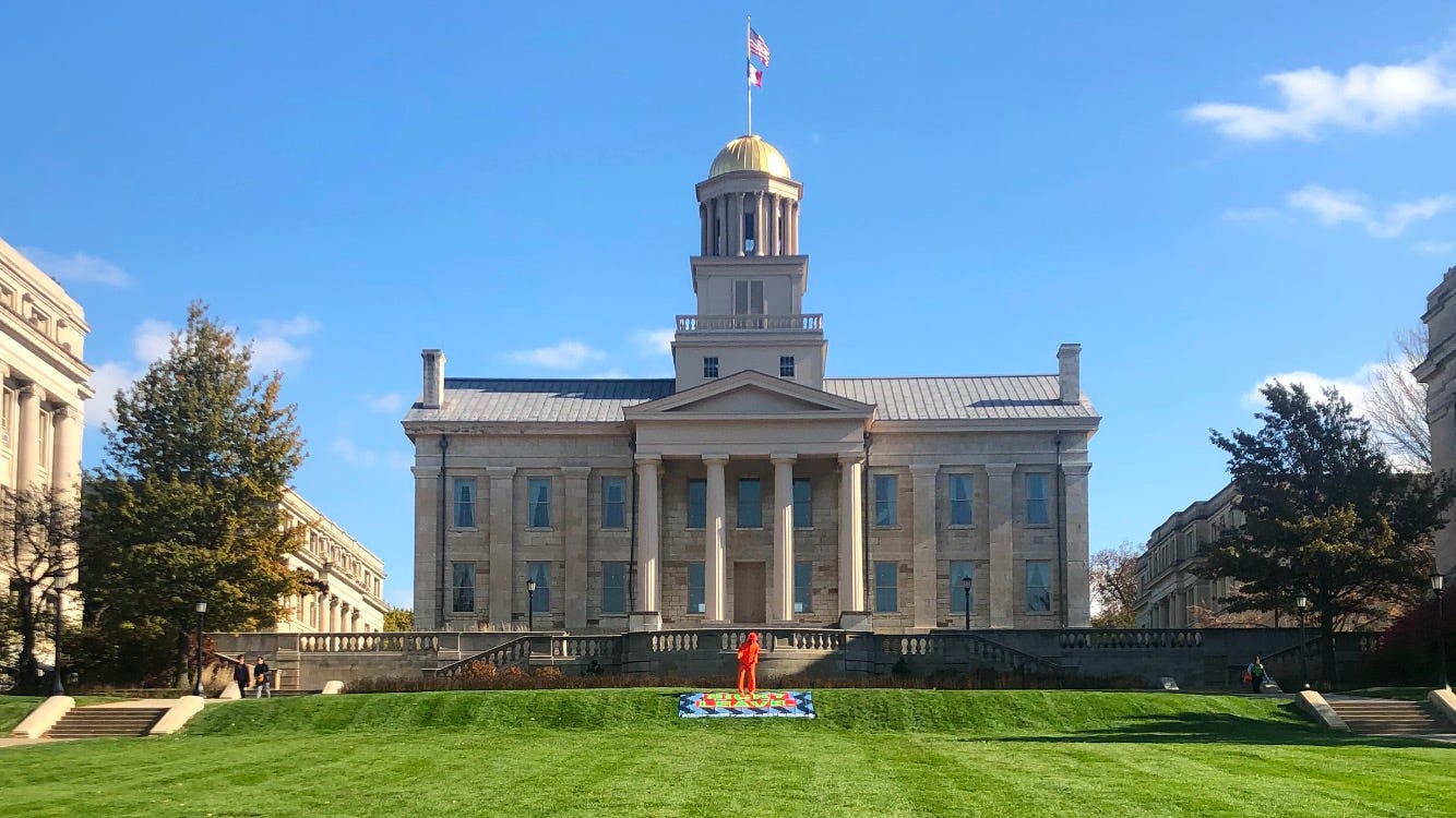 orange figure on uiowa pentacrest
