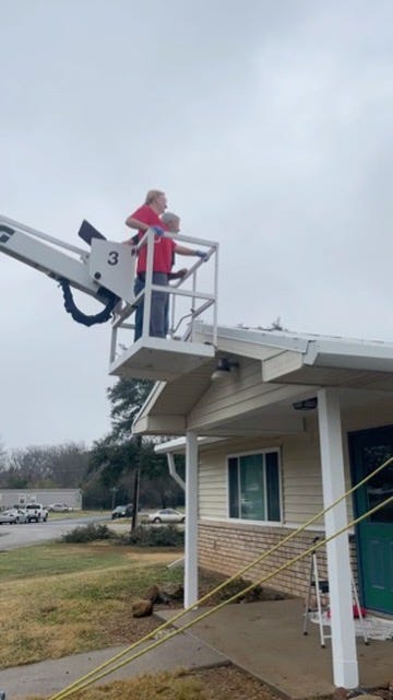 Photos of the halls roof while pressure washing and me enjoying my ride on the lift.