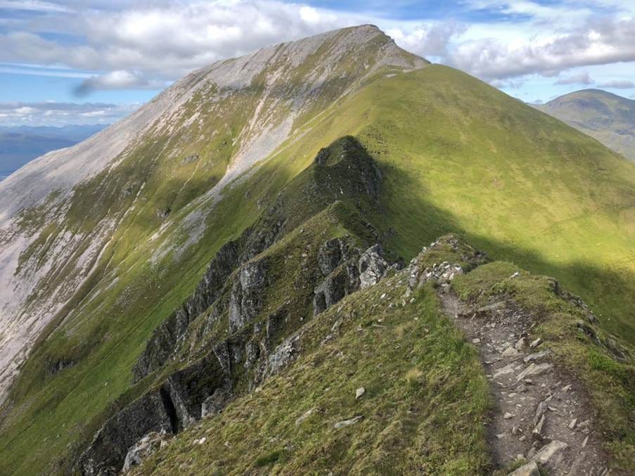 A mountain with a path

AI-generated content may be incorrect.