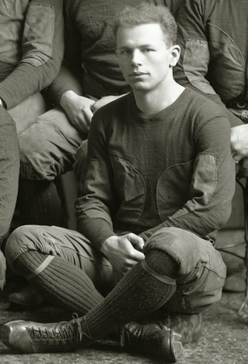 Ray Knode seated in football uniform.