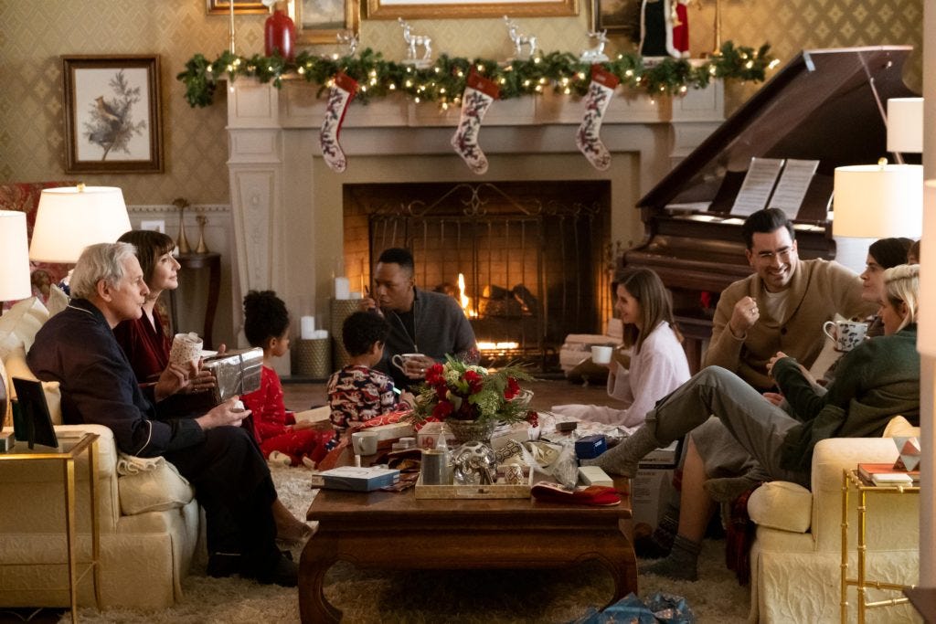 The whole fam damily in their upper middle class front room.
