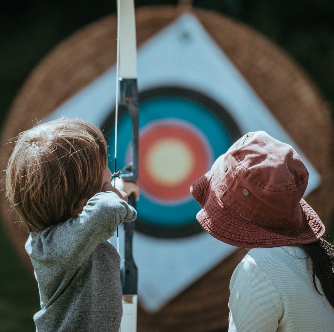 two child playing arrow two child playing arrow