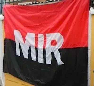 A red and black flag with white text

Description automatically generated