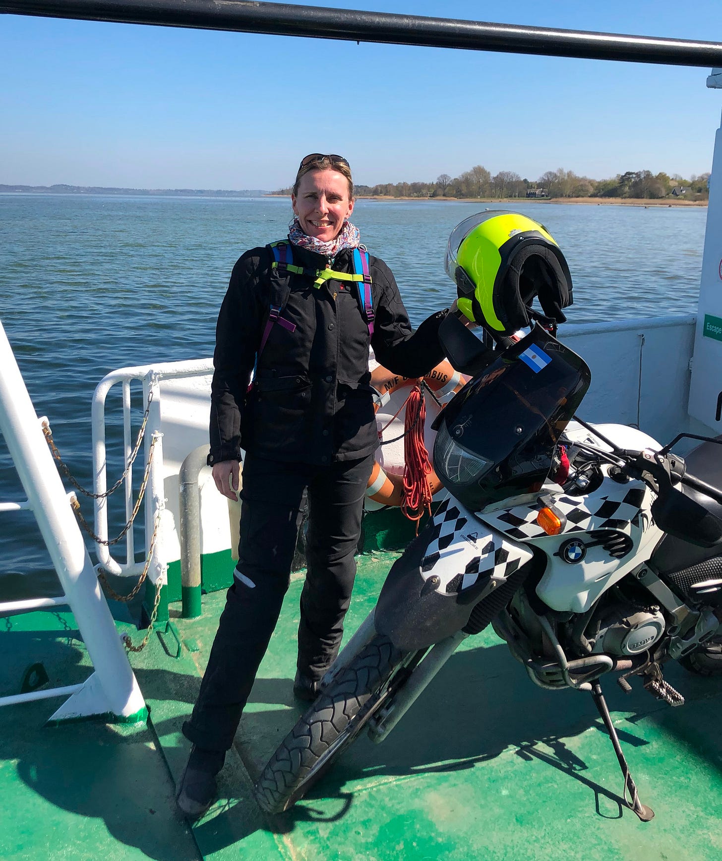 Woman with motorcycle on ferry