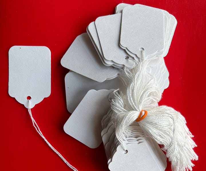 Several images of tags as labels on bags of dried herbs