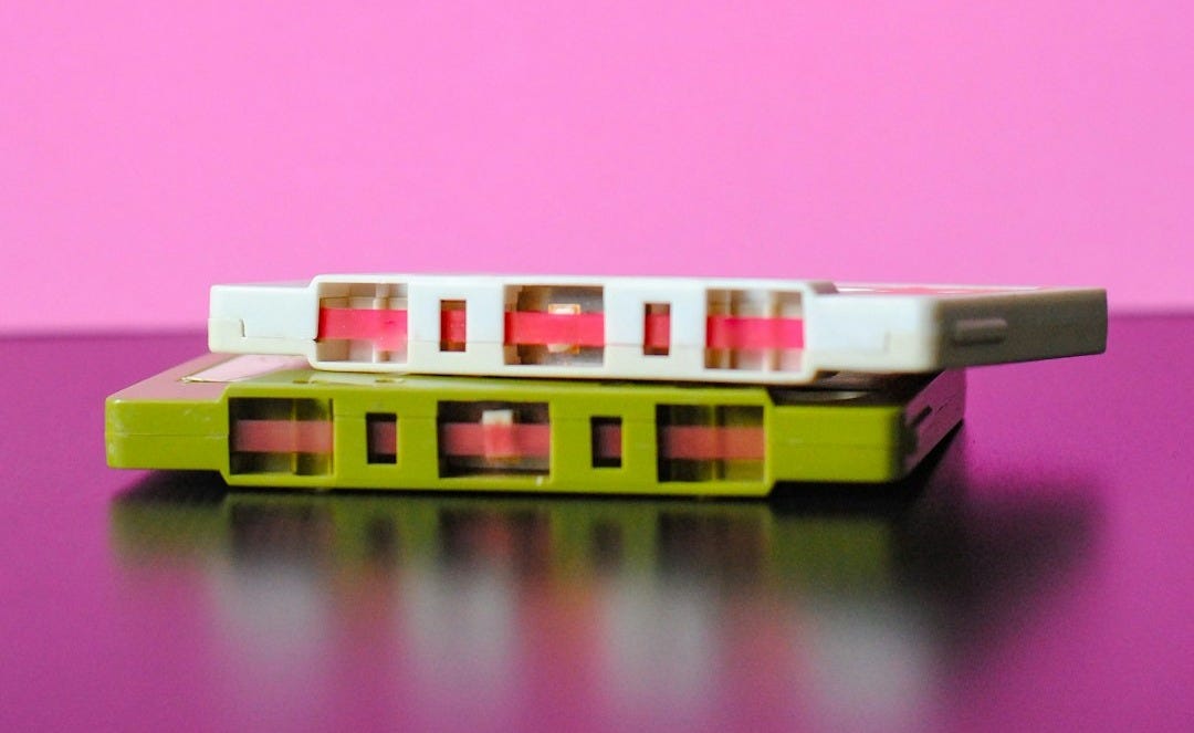 white and green cassette tapes