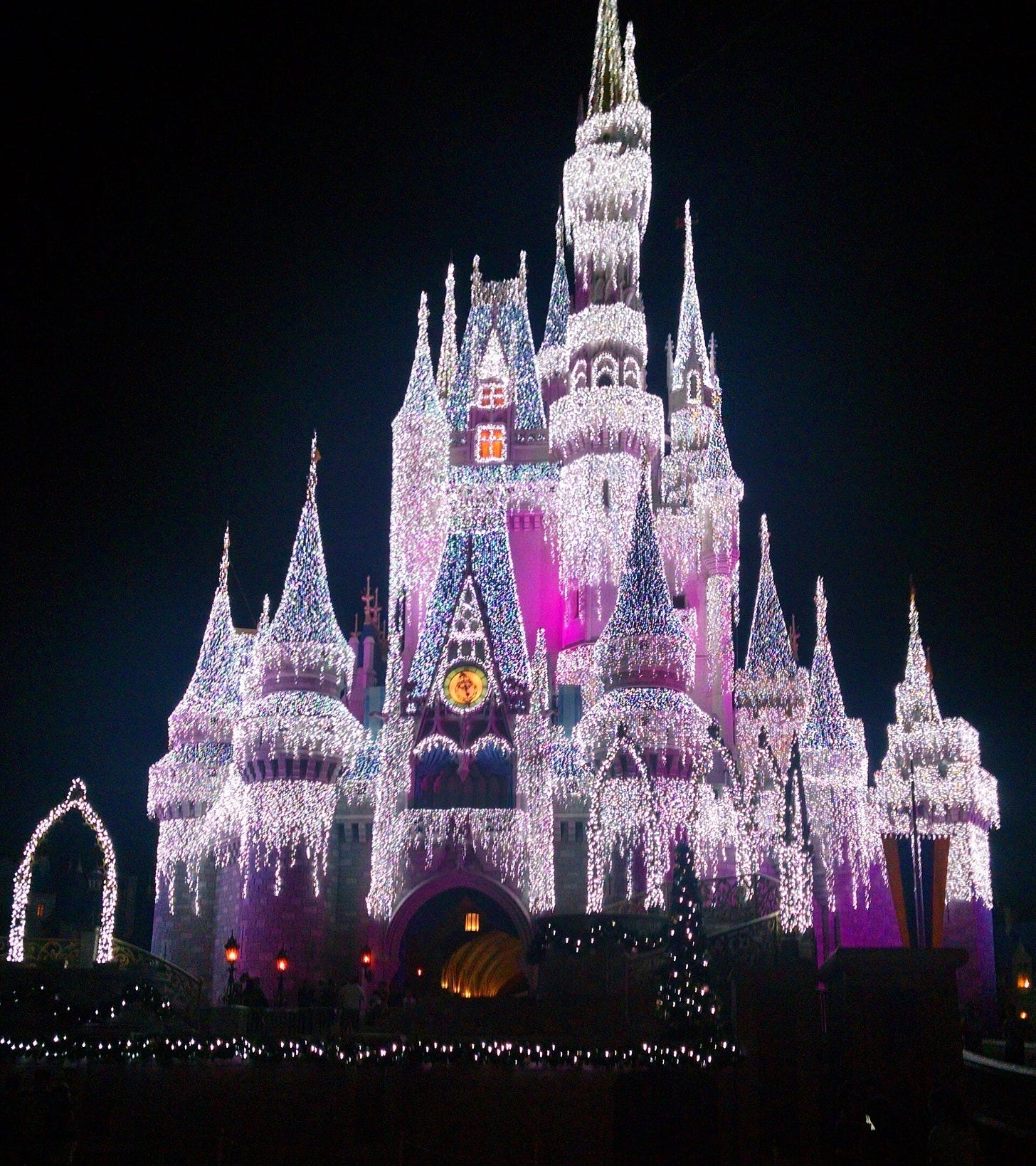 Cinderella Castle in its holiday lights. Image: elisfkc via Wikimedia Commons