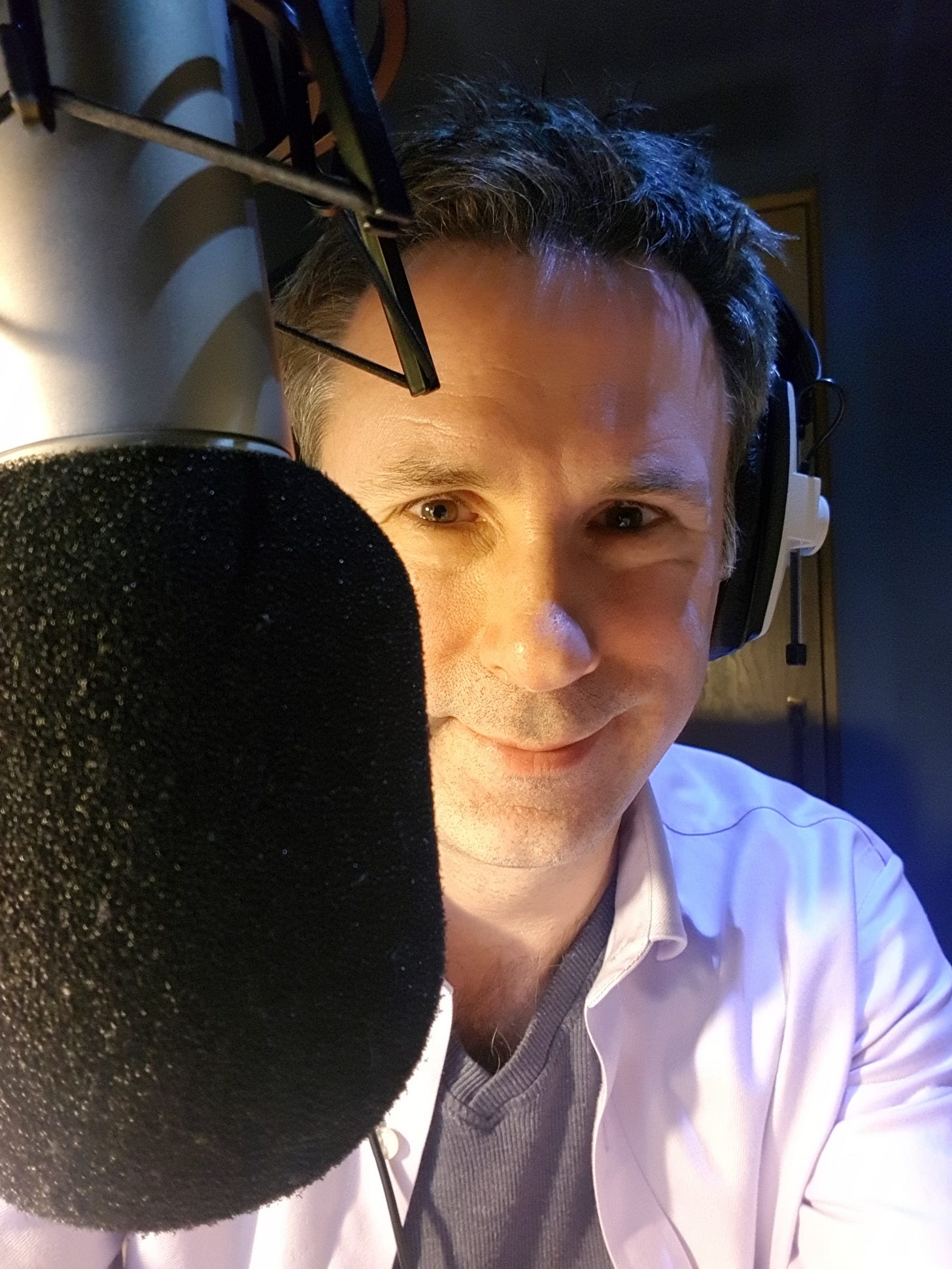 Spencer behind a microphone