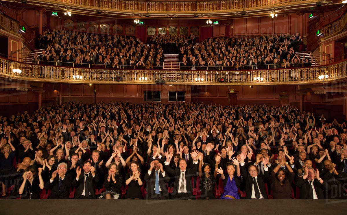 Audience applauding in theater - Stock Photo - Dissolve
