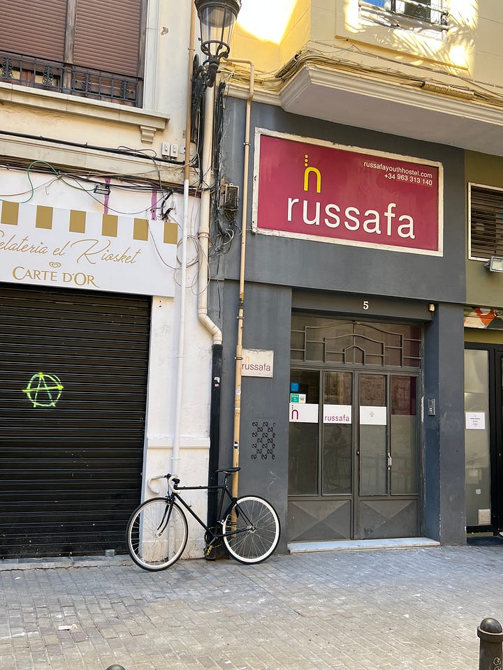 Historic bridge (top left), bicycle in russafa neighborhood (top right), myself at the city of arts and science (bottom left), bicycle in front of shop (bottom right)