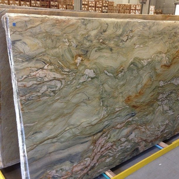 This may contain: a large slab of marble in a warehouse