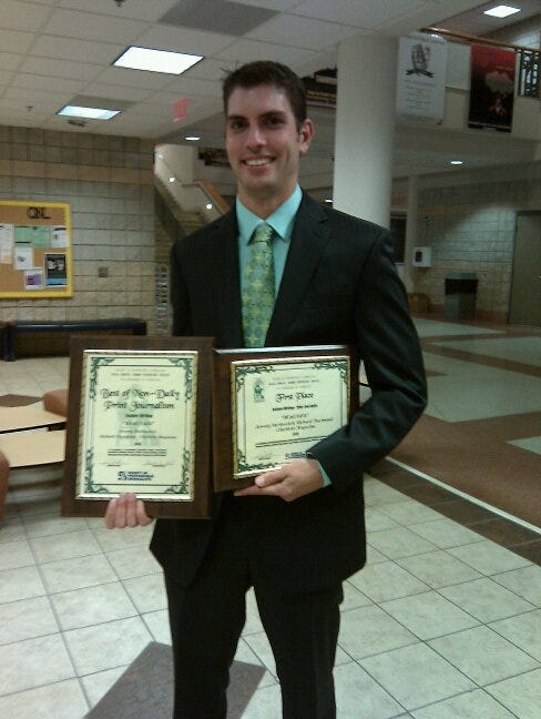 Me holding up two awards.