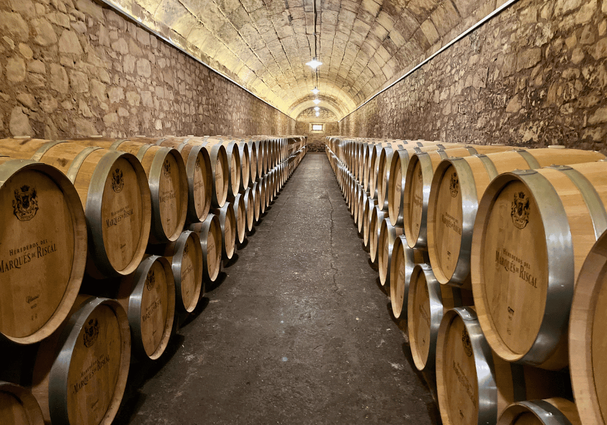 Rows of stacked barrels at Marques de Riscal winery. Rows of stacked barrels at Marques de Riscal winery.