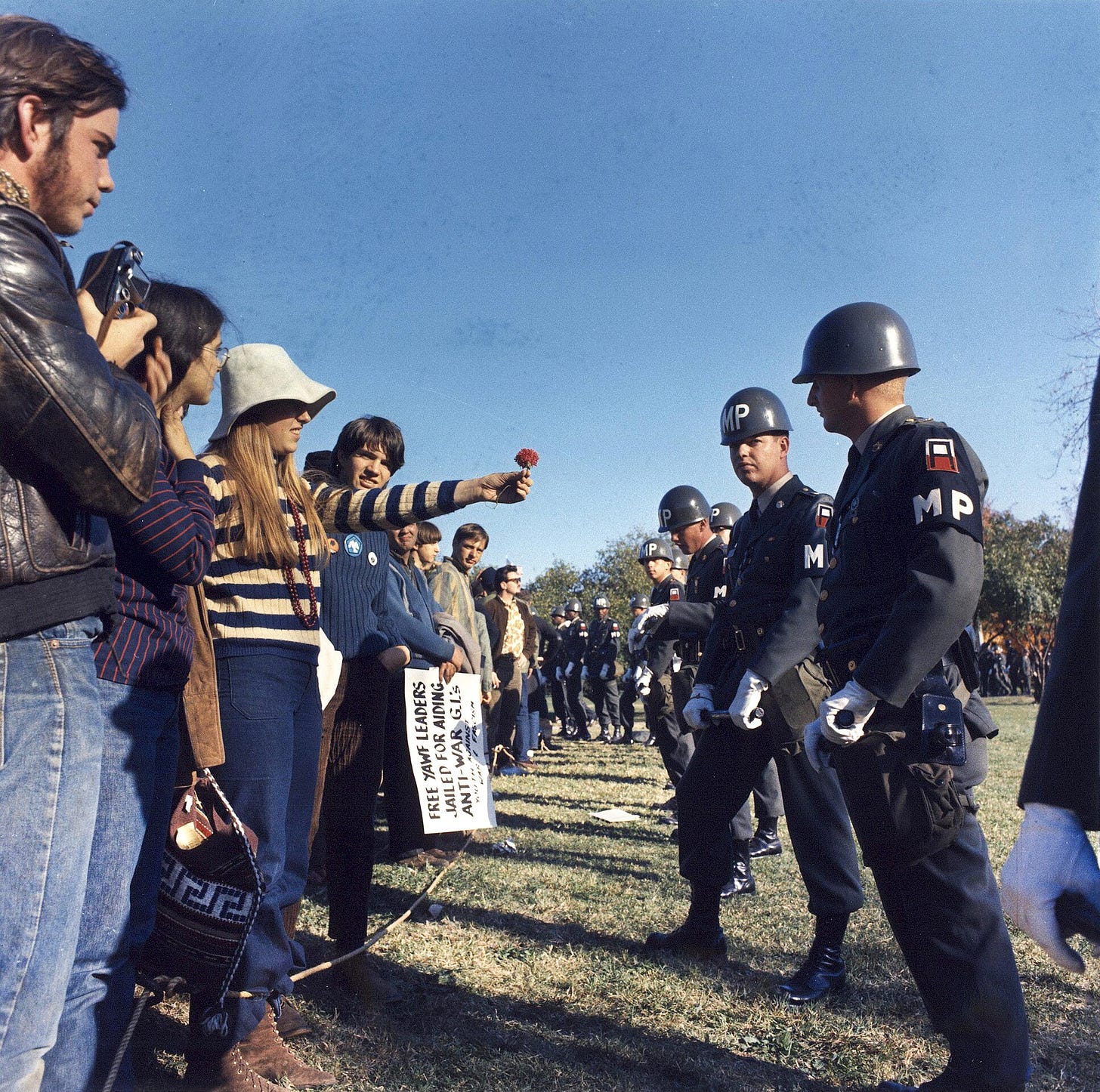 The March on the Pentagon in October 1967 was a largely peaceful protest full of moments including demonstrators handing flowers to military police. The March on the Pentagon in October 1967 was a largely peaceful protest full of moments including demonstrators handing flowers to military police.