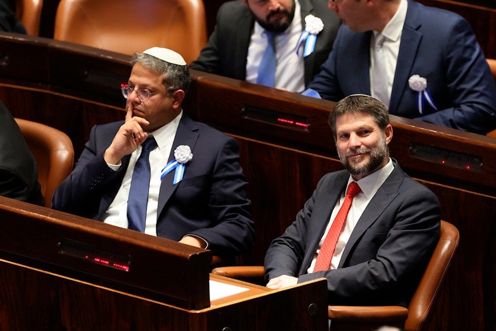 Israeli right wing Knesset member Itamar Ben Gvir, left, and Bezalel Smotrich look on during the swearing-in ceremony for Israeli lawmakers at the Knesset, Israel's parliament, in occupied al-Quds, Tuesday, Nov. 15, 2022. (Pool Photo via AP)