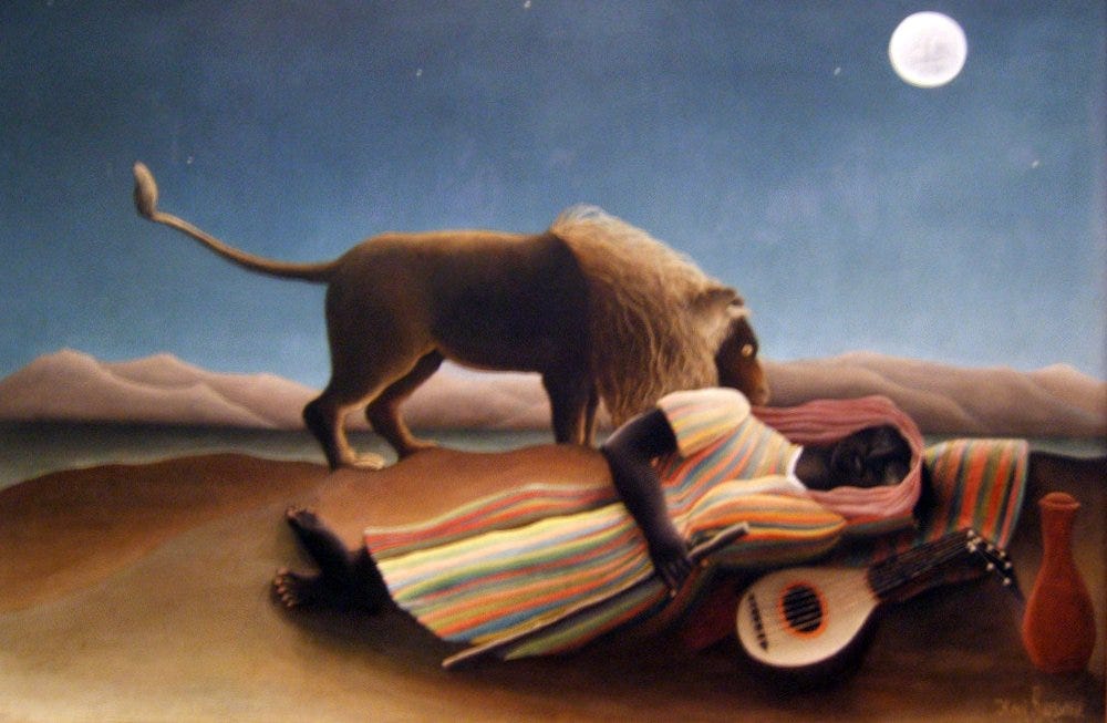 A woman asleep in a desert with a lion standing over her A woman asleep in a desert with a lion standing over her