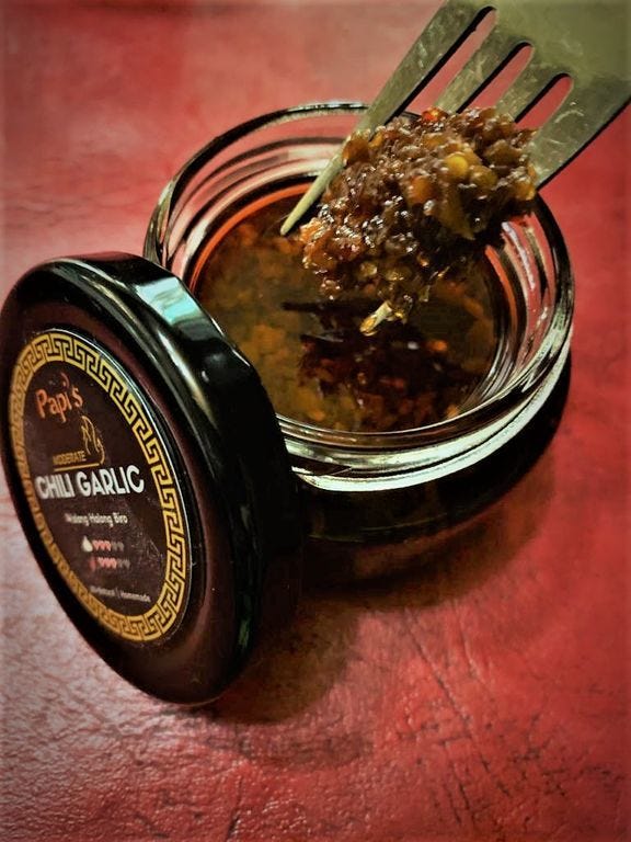 Papi's Chili Garlic Getting a spoonful of Papi's Chili Garlic